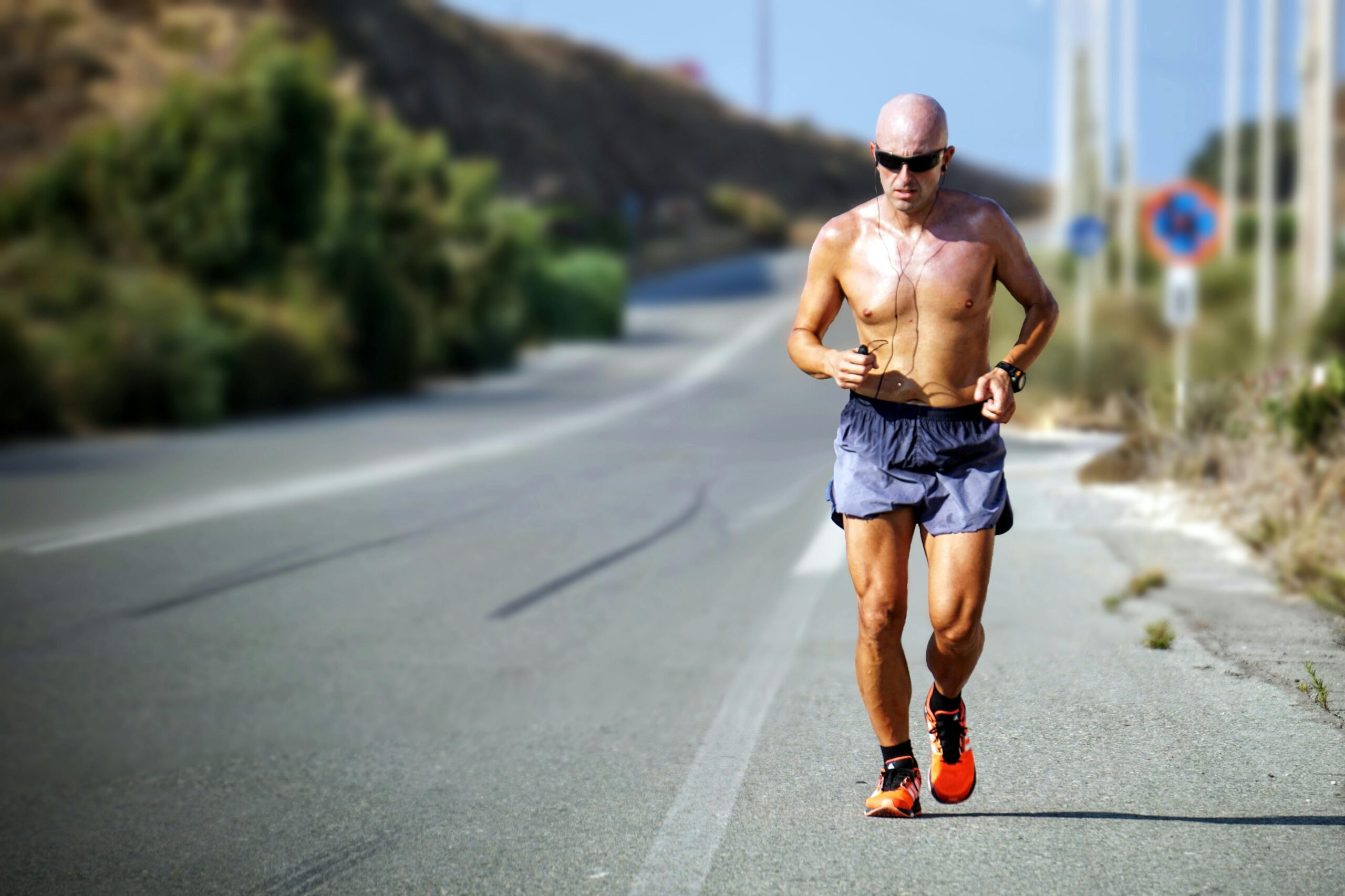 pexels-mvdheuvel-2284163 shirtless bald man jogging